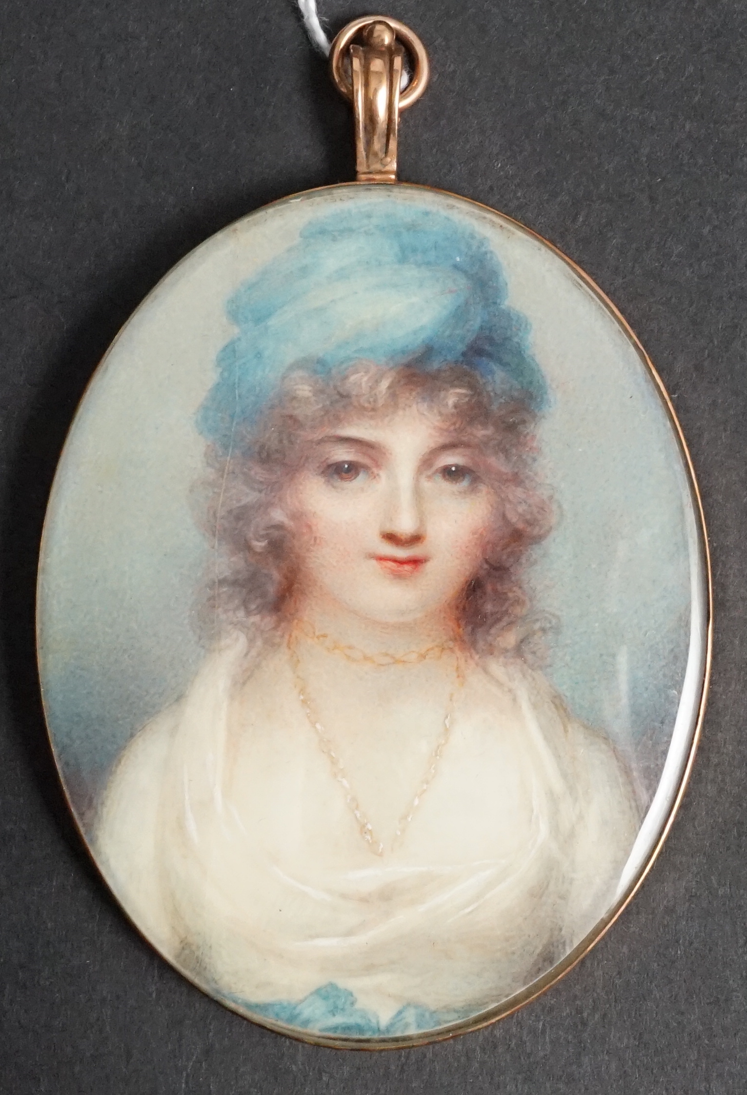 Mrs Anne Mee, née Foldsone (British, 1775-1851), Portrait miniature of a lady wearing a blue hat, white dress and gold chain, watercolour on ivory, 7.5 x 5.8cm. CITES Submission reference 82LL68YT